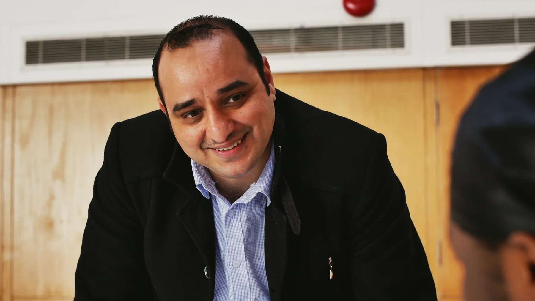 Muhammad Achour in conversation during a community or educational setting