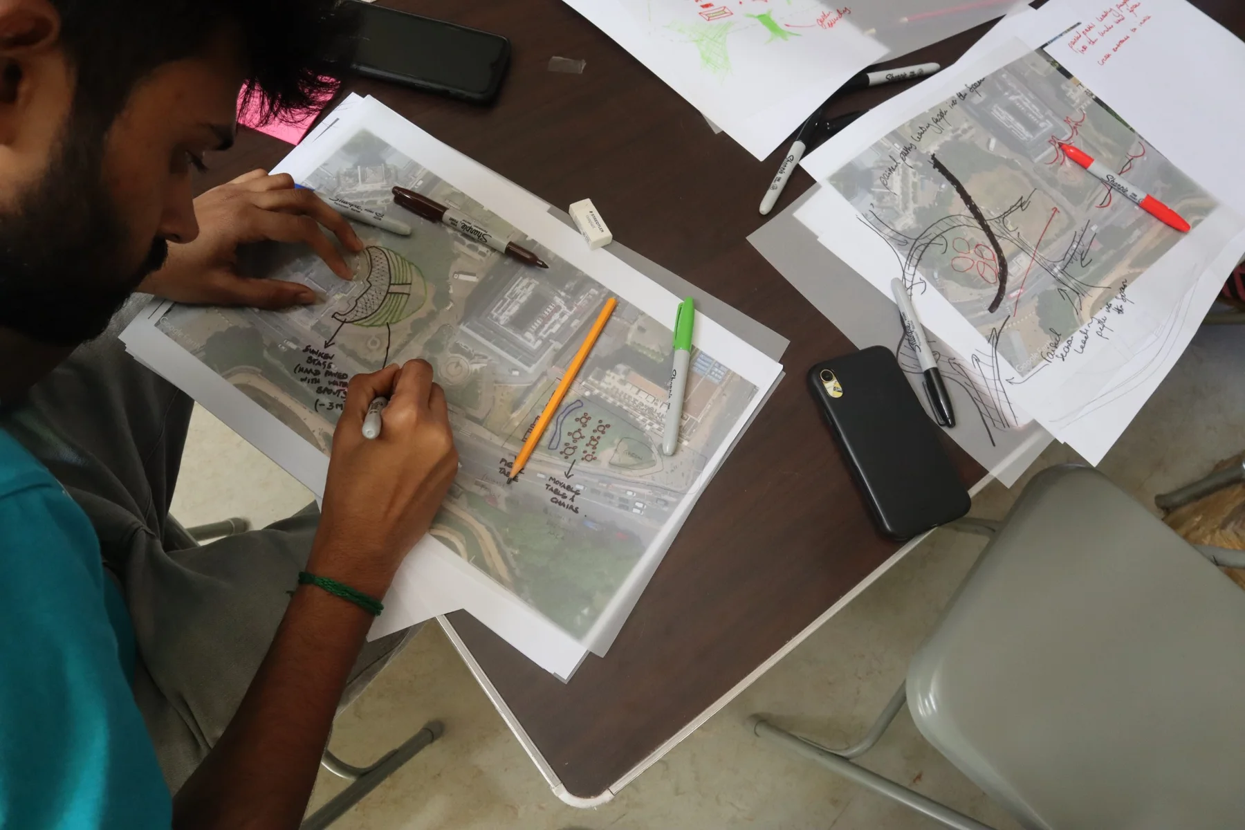 Participatory design workshop with annotated maps, drawings and markers